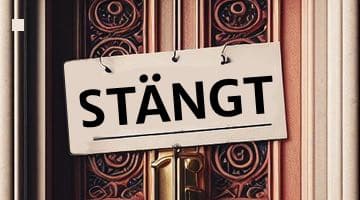 Bild på en skylt där det står "Stängt" som hänger framför en dörr.